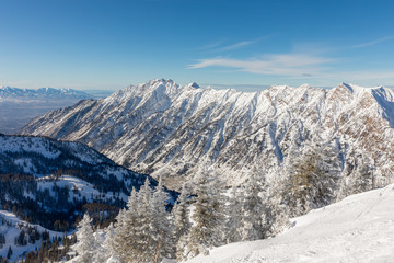 Mountains and skyline viewed from Hidden Peak at Snowbird in Little Cottonwood Canyon in the Wasatch Range near Salt Lake City, Utah, USA.