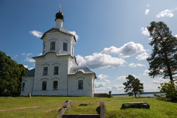 Fototapeta premium Church of the Exaltation of the Holy Cross in the Nile Desert. Nilo-Stolobenskaya Pustyn. Is situated on Stolobny Island in Lake Seliger. Tver region, Russia