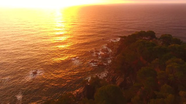 Aerial Drone Shot of Calella de Palafrugell Coastline and City During Sunrise