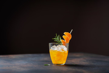 Alcoholic cocktail with mandarins