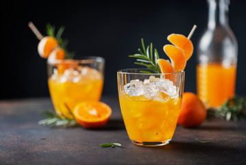 Alcoholic cocktail with mandarins