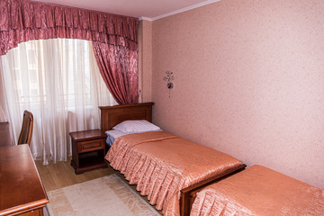 Interior of hotel apartment, bedroom. Luxury or classic bedroom with warm light of hotel resort.