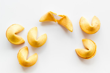 Traditional fortune cookies on white table top-down