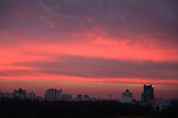Photo of gloomy sky colororg over the city in the morning