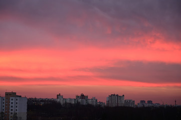 Plakat Photo of gloomy sky colororg over the city in the morning