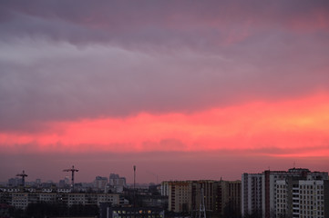 Photo of gloomy sky colororg over the city in the morning
