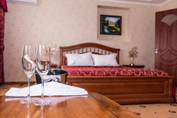 Interior of hotel apartment, bedroom. Luxury or classic bedroom with warm light of hotel resort.