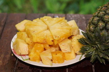 Pineapple collection. Whole and sliced pineapple isolated on white background and blurred background.