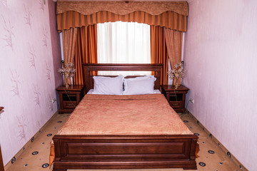 Interior of hotel apartment, bedroom. Luxury or classic bedroom with warm light of hotel resort.