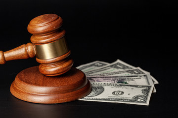 Law mallet and a stack of money