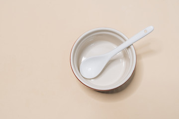 Close-up view of single empty white bowl ready for breakfast