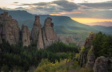 Fototapeta premium Beautiful landscape with bizarre rock formations. Stone stairs leading to the amazing rock formations and walls of a medieval fortress in Belogradchik, northwest Bulgaria. Panorama 