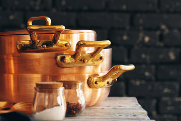 Close up of a set of copper cookware