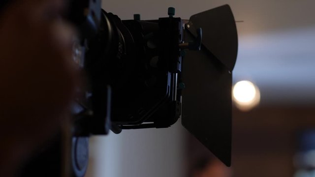 Close-up Of A Professional Video Camera In Use With A Matte Box On The Lens.