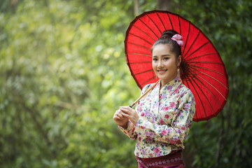 Beautiful Thai woman in Traditional Thai dress