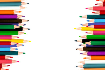 multicolored pencils on a white background. top view.