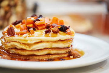 pancakes with nuts, honey and dried apricots