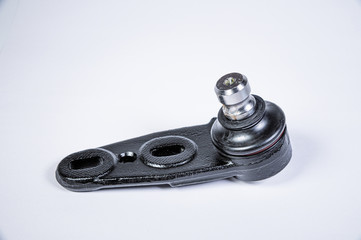 New spare parts spherical ball joints of a suspension bracket of a car on a gray background