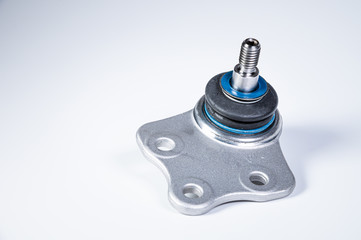 New spare parts spherical ball joints of a suspension bracket of a car on a gray background