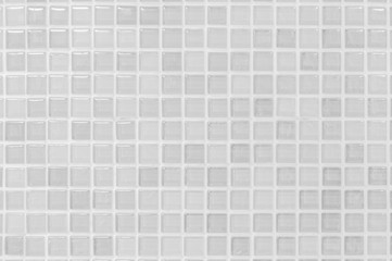 White or gray ceramic wall and floor tiles abstract background. Design geometric mosaic texture decoration of the bedroom. Simple seamless pattern for backdrop hospital wall, canteen and grid paper.