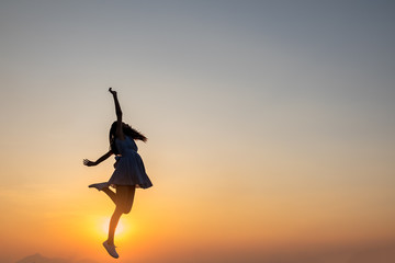 Young asia woman jumping in the sky and feeling free,happy
