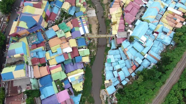 Cinematic 4k aerial video with smooth motion of colorful rainbow village Jodipan on Java, Indonesia 