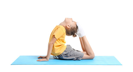 Obraz premium Little girl practicing yoga on white background
