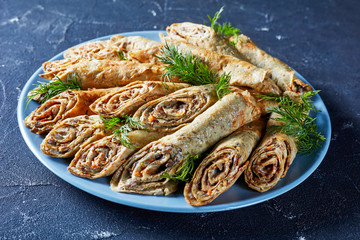 buckwheat crepe rolls with meat, veggies, top view