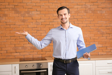 Portrait of male real estate agent indoors