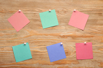 Sticky notes on wooden background