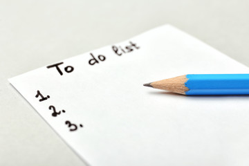 Empty to do list with pencil on white background, closeup