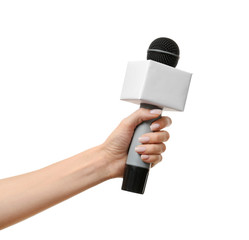 Journalist's hand with microphone on white background