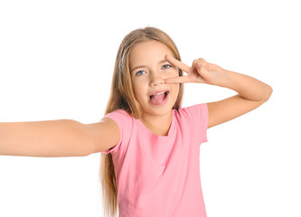 Cute little girl taking selfie on white background