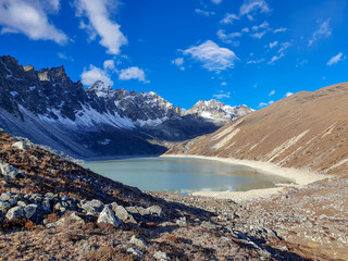 Donag Tsho, the fourth Gokyo lake., hills and snow-capped mountains. Sunny day and marvellous blue...