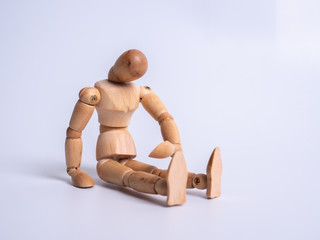 The wooden dummy sits on white background