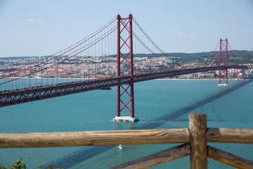 Famous Abril bridge in Lisbon, crossing the Tagus River