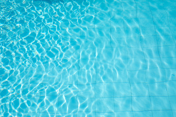 ripped water in swimming pool .surface of blue swimming pool,background of water in swimming pool.