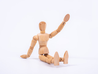 The wooden dummy sits on white background