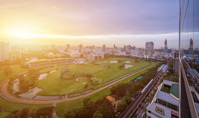 City view of green stadium field of horserunner in the Bangkok Sports Club.