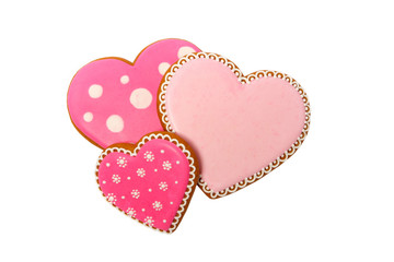 background from pink cookies heart shaped with different patterns, isolated on white