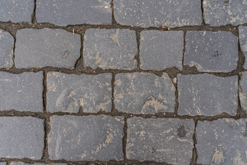 paving stones close up. graphic gray background.
