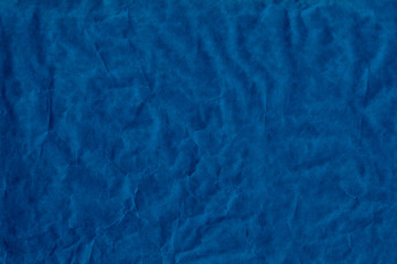 Empty blue sheet brown crumpled wrapping or parchment paper. Texture or background. Space for...