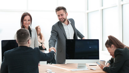 welcome handshake of business people in the office.