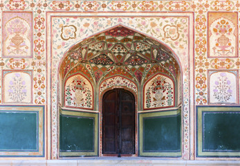 Stunning facade of Ganesh Pol entrance in Amber Fort Palace, Jaipur, Rajasthan, India