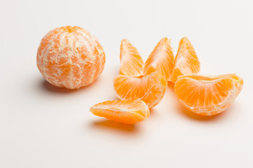 Tangerine orange-skinned sweet fruit of the citrus family.