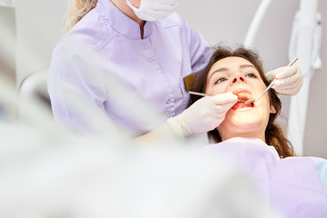 Patient in the treatment chair with open mouth