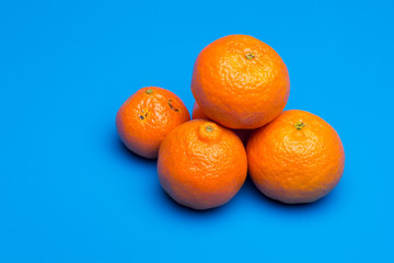 Tangerine orange-skinned sweet fruit of the citrus family.