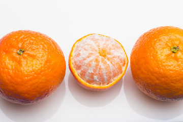 Tangerine orange-skinned sweet fruit of the citrus family.