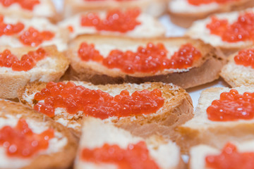 caviar with butter background. red caviar with butter close-up.