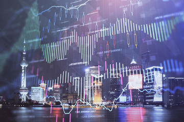 Financial graph on night city scape with tall buildings background double exposure. Analysis concept.